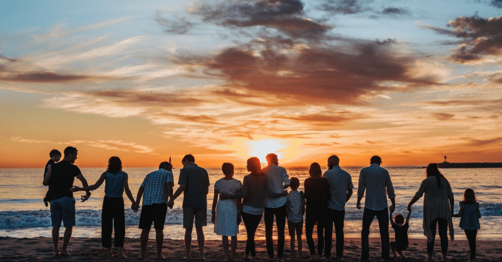 Image of many adults and children at the beach – Expanding Wallet